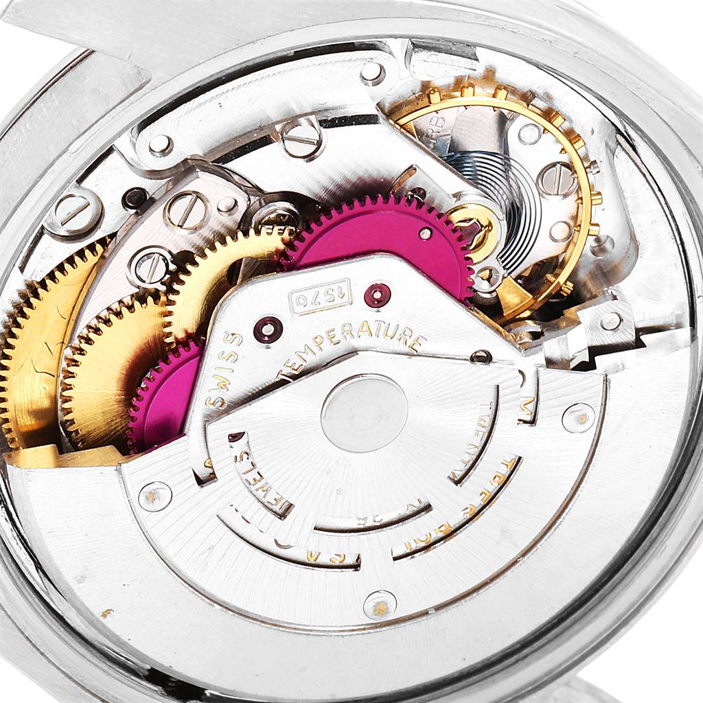 The image shows a close-up of the movement mechanism of a Rolex Vintage Collection 1500 Men's Stainless Steel Blue Dial 1500 Men's Stainless Steel Blue Dial watch.