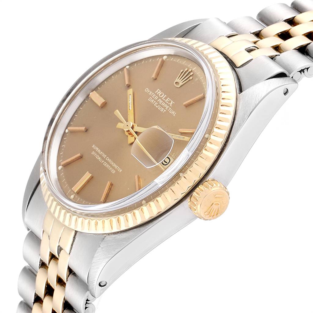 The image shows a side angle of a Rolex Vintage Collection 1601 Men's Steel and Gold (two tone) Brown Dial 1601 Men's Steel and Gold (two tone) Brown Dial watch featuring the dial, bezel, crown, and part of the bracelet.