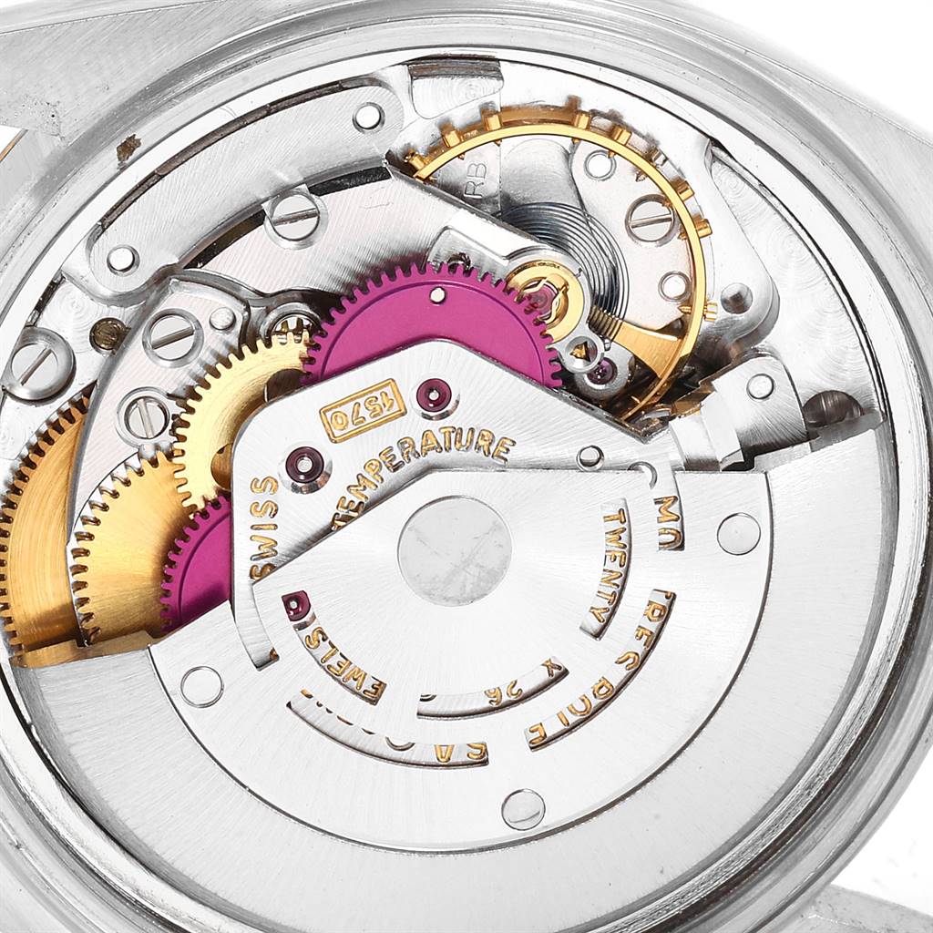 This image shows the vintage Rolex Collection watch's movement from a close-up angle, highlighting gears and internal components.