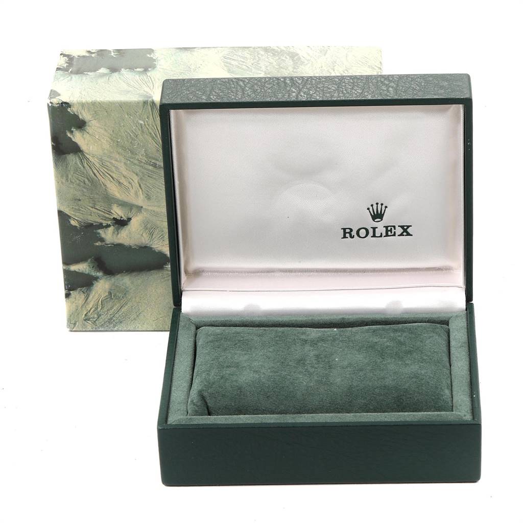 The image shows an open green Rolex box for the Vintage Collection model, with the cushion and brand logo inside.