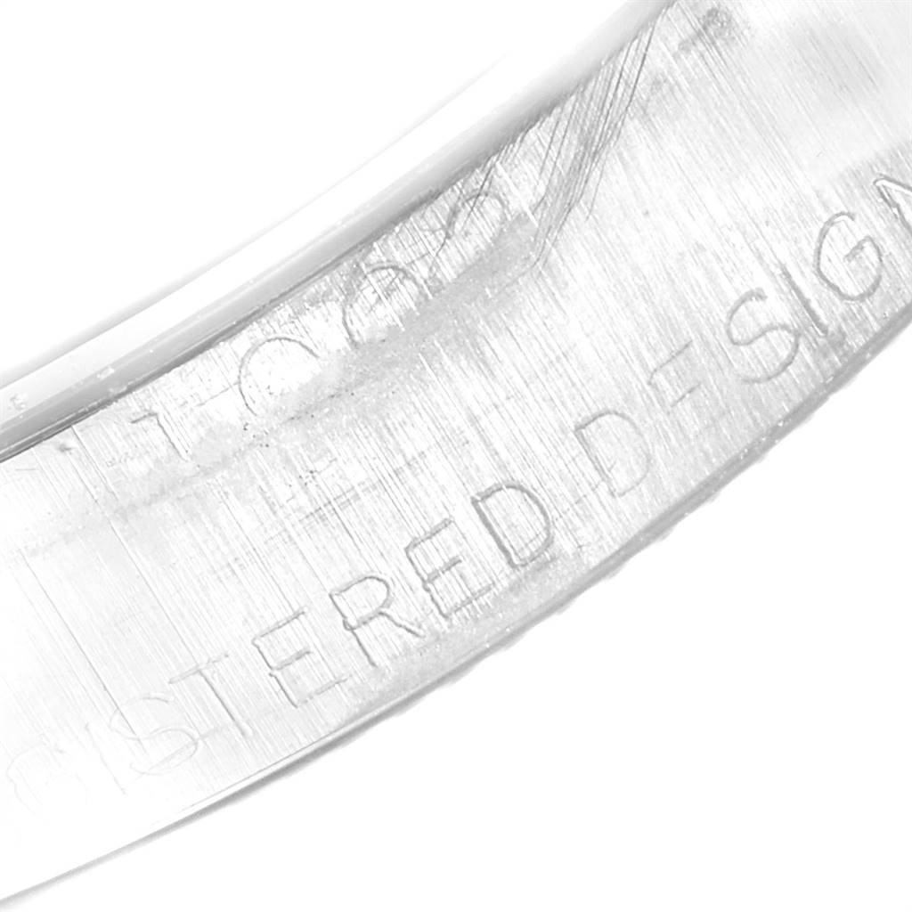 The image shows a close-up of the inner caseback engraving of a Vintage Collection model by Rolex.