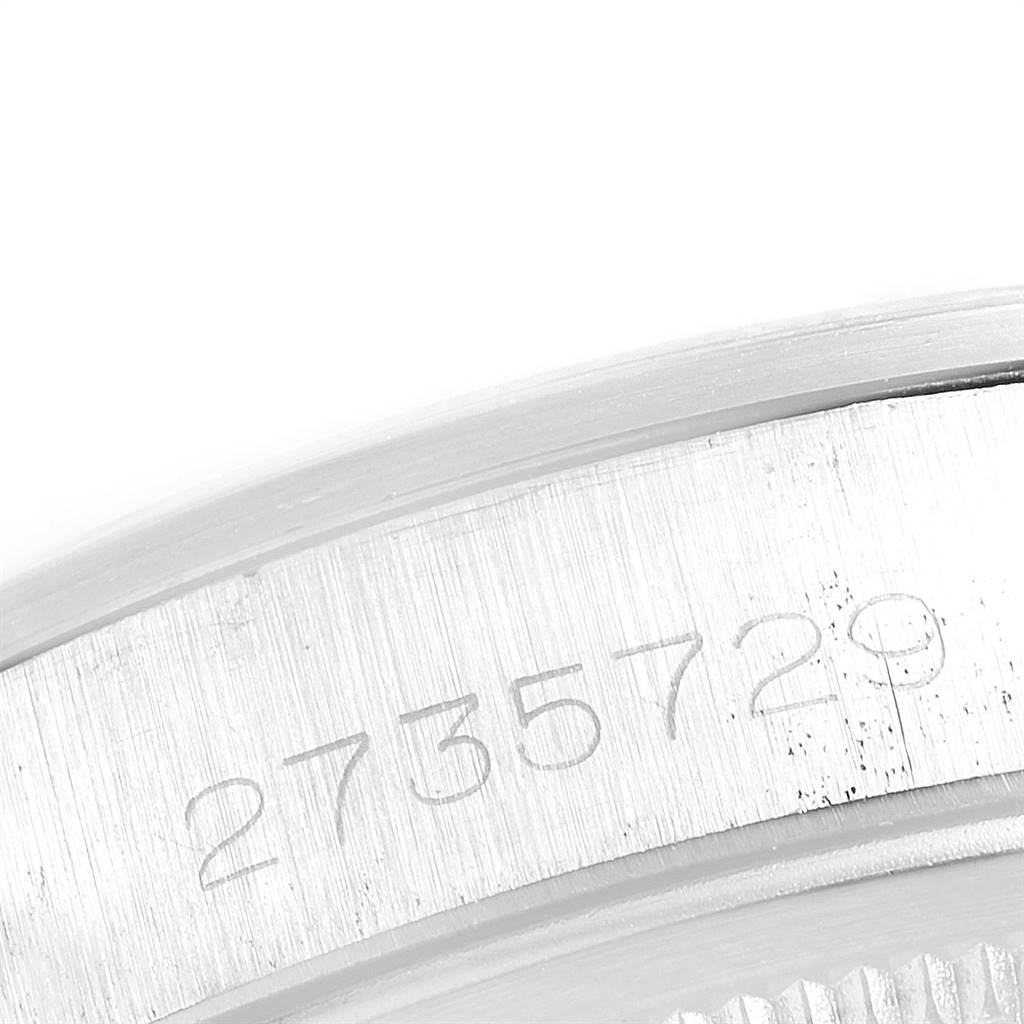 This close-up image shows the engraved serial number on the case of a Rolex Vintage Collection 1500 Men
s Stainless Steel Silver Dial 1500 Men
s Stainless Steel Silver Dial model watch.