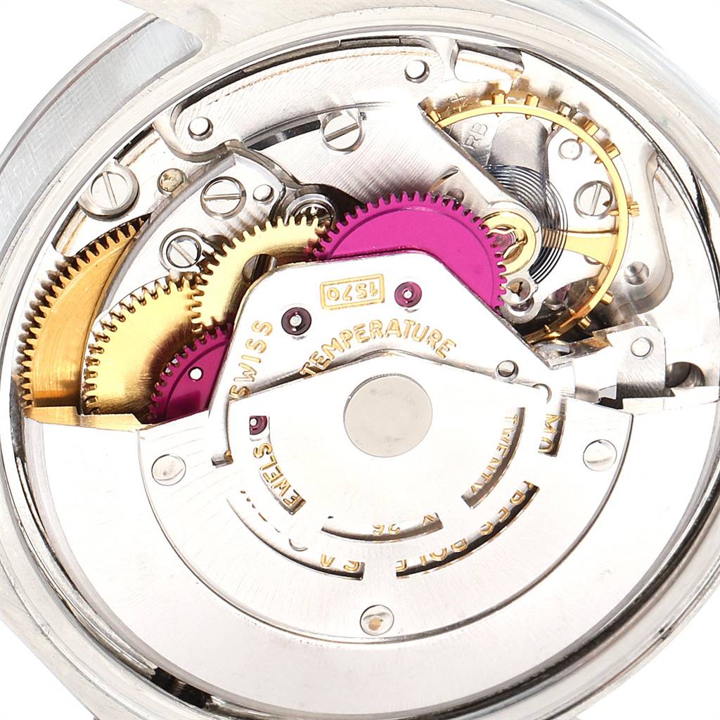 The image shows the intricate internal gears and mechanism of a Rolex Vintage Collection 1500 Men
s Stainless Steel Silver Dial 1500 Men
s Stainless Steel Silver Dial watch from a close-up angle.
