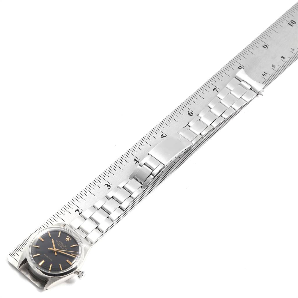 The image shows a Vintage Collection Rolex watch horizontally aligned with a ruler, displaying the band and face.