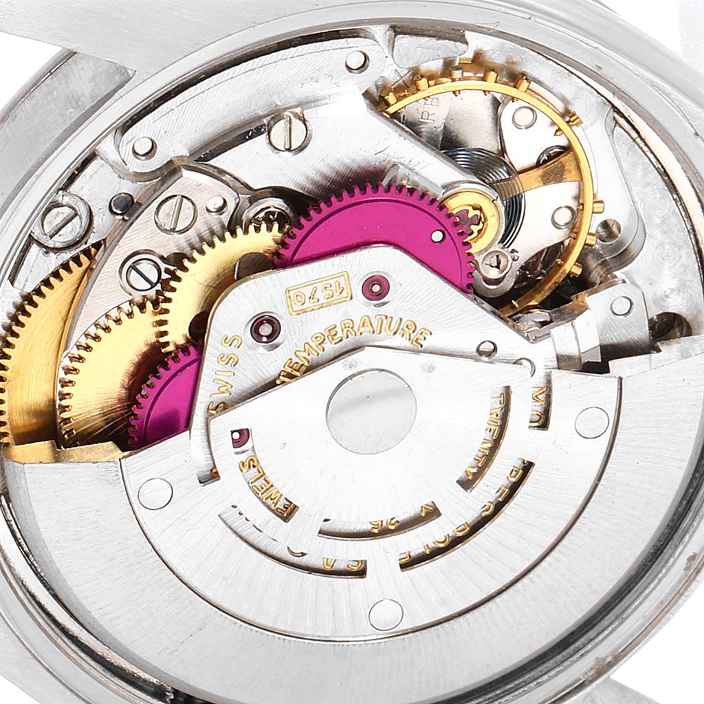 This image shows the internal mechanism and gears of a Vintage Collection model by Rolex from a close-up angle.