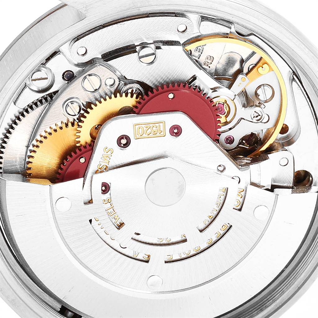 The image shows a close-up view of the movement mechanism inside a Vintage Collection Rolex watch.