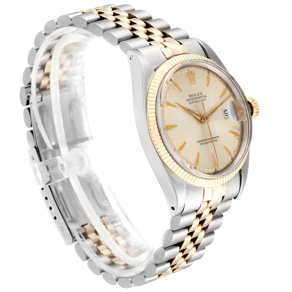 The image shows a side view of a Vintage Collection Rolex watch, highlighting its bezel, dial, crown, and two-tone bracelet.