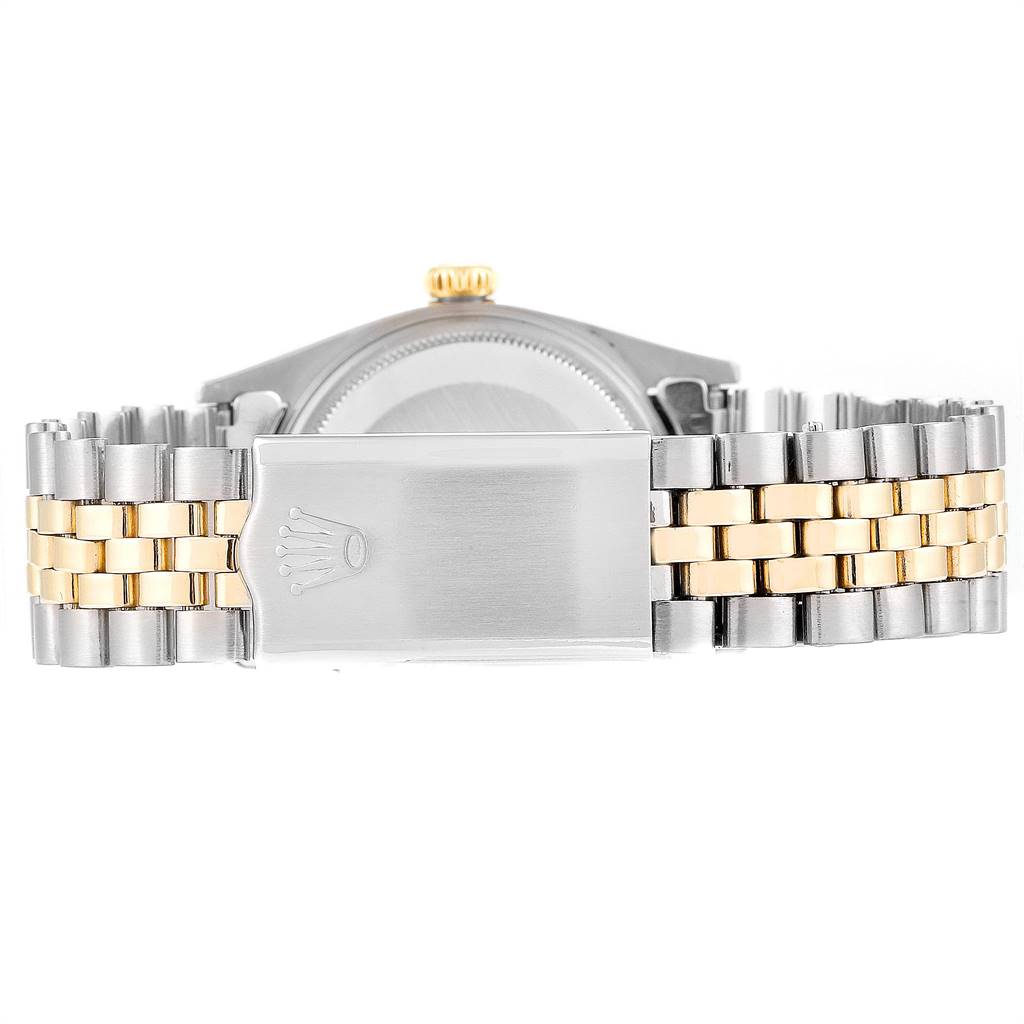 The image shows the clasp and part of the bracelet of a Vintage Collection Rolex watch from the back angle.