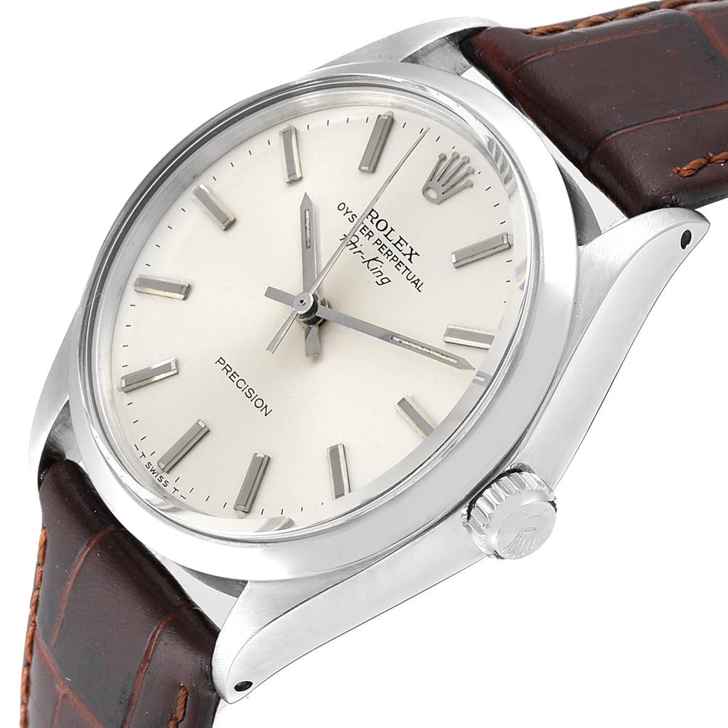 The image shows a Rolex Vintage Collection 5500 Men
s Stainless Steel Silver Dial 5500 Men
s Stainless Steel Silver Dial model watch from a slight angle, highlighting the face, bezel, crown, and brown leather strap.