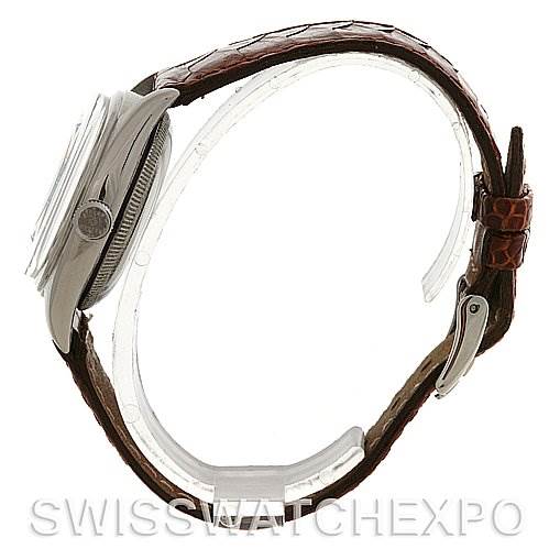 The image shows a side view of a Rolex Vintage Collection 5048 Men's Stainless Steel Silver Dial 5048 Men's Stainless Steel Silver Dial watch with a focus on the case, crown, and brown leather strap.