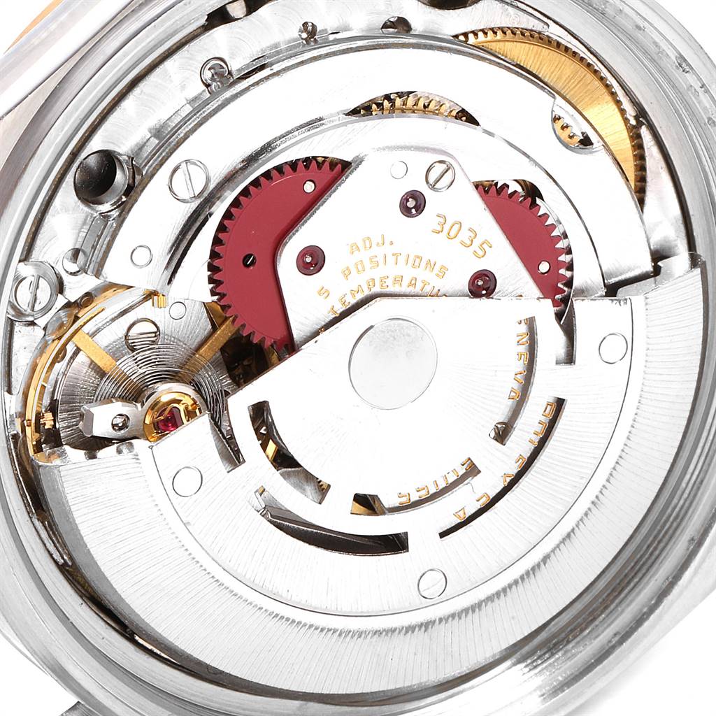 The image shows the internal movement mechanism of the Vintage Collection model by Rolex, viewed from the back.