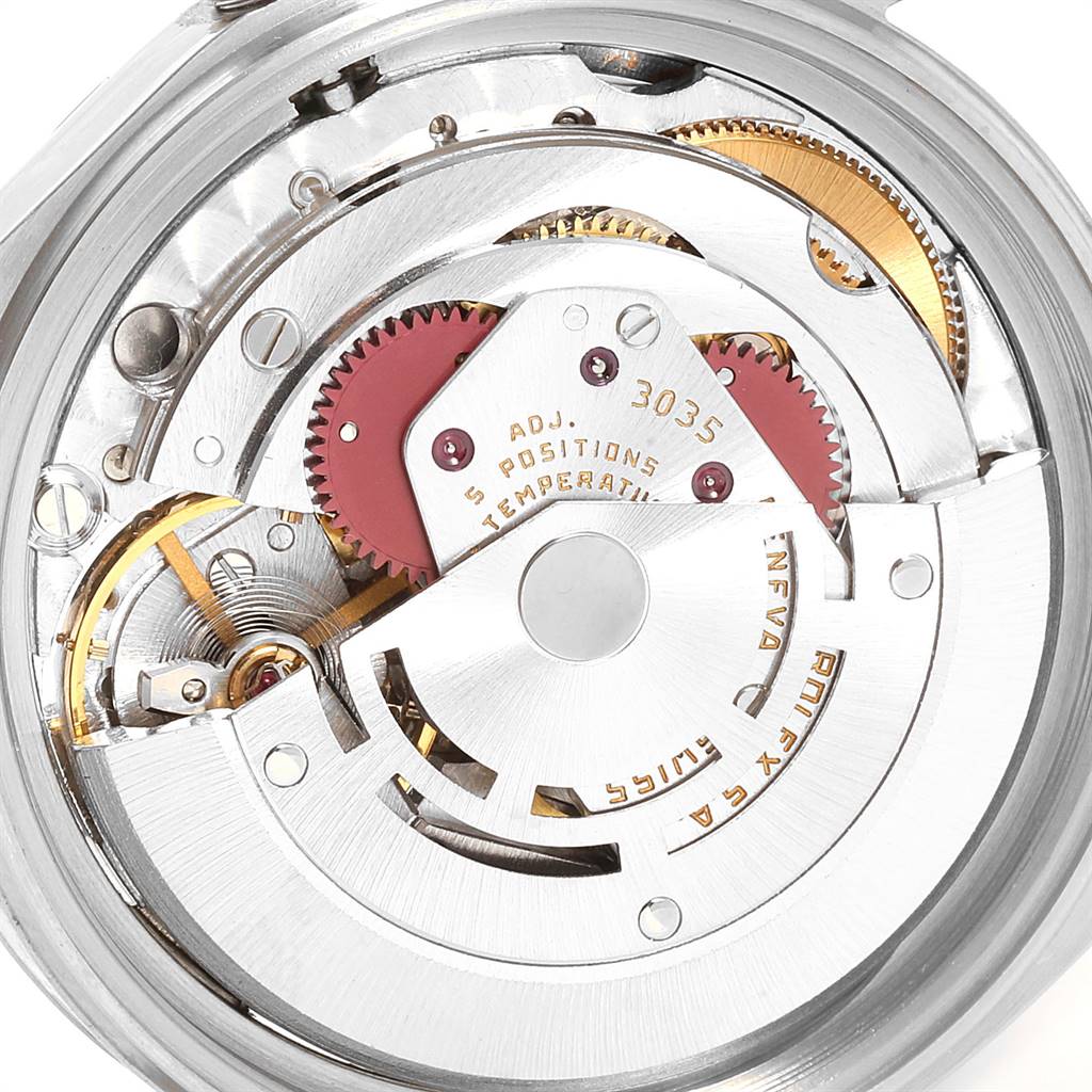 This is a close-up view of the internal mechanism of the Rolex Vintage Collection 16013 Men's Stainless Steel Champagne Dial 16013 Men's Stainless Steel Champagne Dial model watch, showing its gears and rotor.