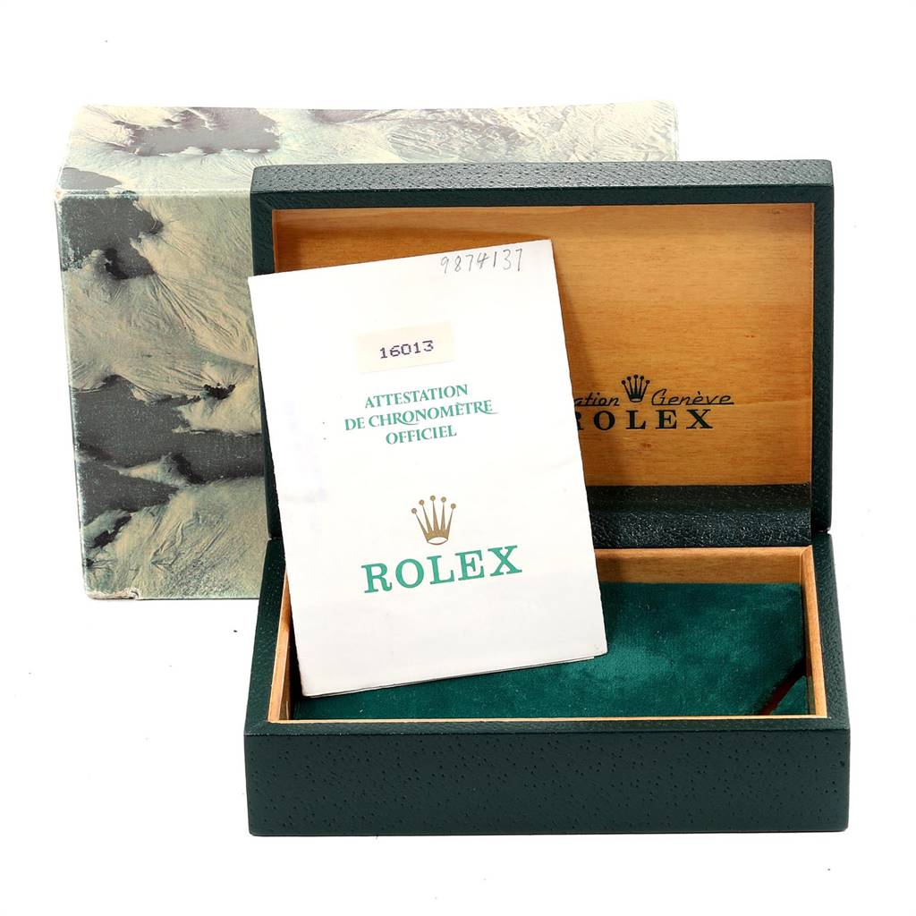 This image shows the open box and certificate for the Rolex Vintage Collection 16013 Men's Stainless Steel Champagne Dial 16013 Men's Stainless Steel Champagne Dial model 16013.