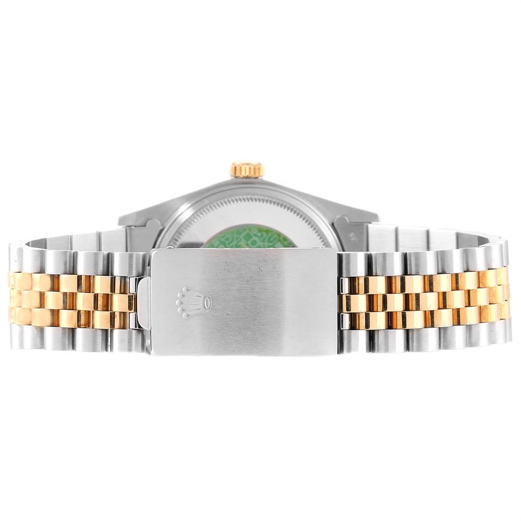 This image shows the back of a Rolex Vintage Collection 16013 Men's Stainless Steel Champagne Dial 16013 Men's Stainless Steel Champagne Dial watch, highlighting the bracelet and clasp with the Rolex logo.