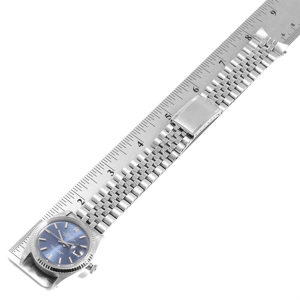 The image shows a Rolex Vintage Collection 1601 Men's Stainless Steel Blue Dial 1601 Men's Stainless Steel Blue Dial model watch with a blue dial and metal bracelet, measured against a ruler.