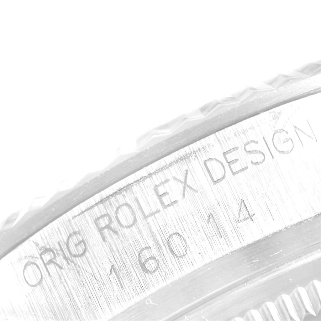 The image shows a close-up of the engraved bezel detail on the Rolex Vintage Collection 16014 Men
s Stainless Steel Silver Dial 16014 Men
s Stainless Steel Silver Dial model.