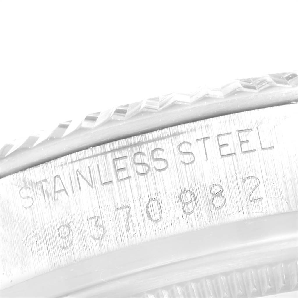 The image shows a close-up of the stainless steel case with serial number engraving on a Vintage Collection model by Rolex.