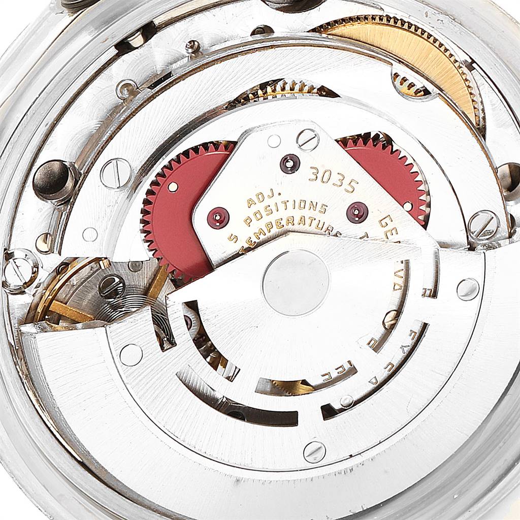 Close-up view of the internal mechanism of a Rolex Vintage Collection 16014 Men
s Stainless Steel Silver Dial 16014 Men
s Stainless Steel Silver Dial watch, showing gears and components.