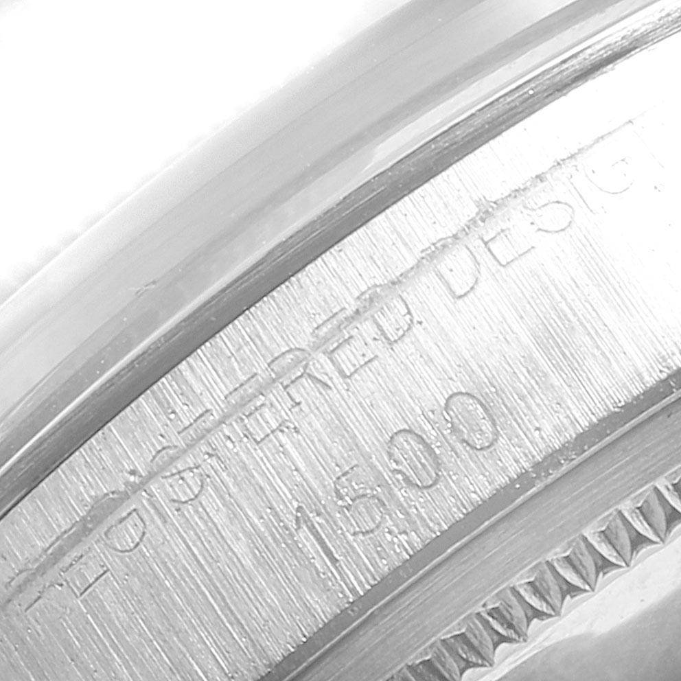 This close-up image shows the engraved bezel of the Rolex Vintage Collection 1500 Men
s Stainless Steel Silver Dial 1500 Men
s Stainless Steel Silver Dial watch, focusing on its model number and registered design text.