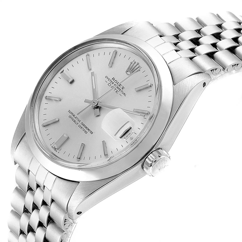 This is a side angle view of a Rolex Vintage Collection 1500 Men
s Stainless Steel Silver Dial 1500 Men
s Stainless Steel Silver Dial watch, showing the crown, face, and part of the bracelet.