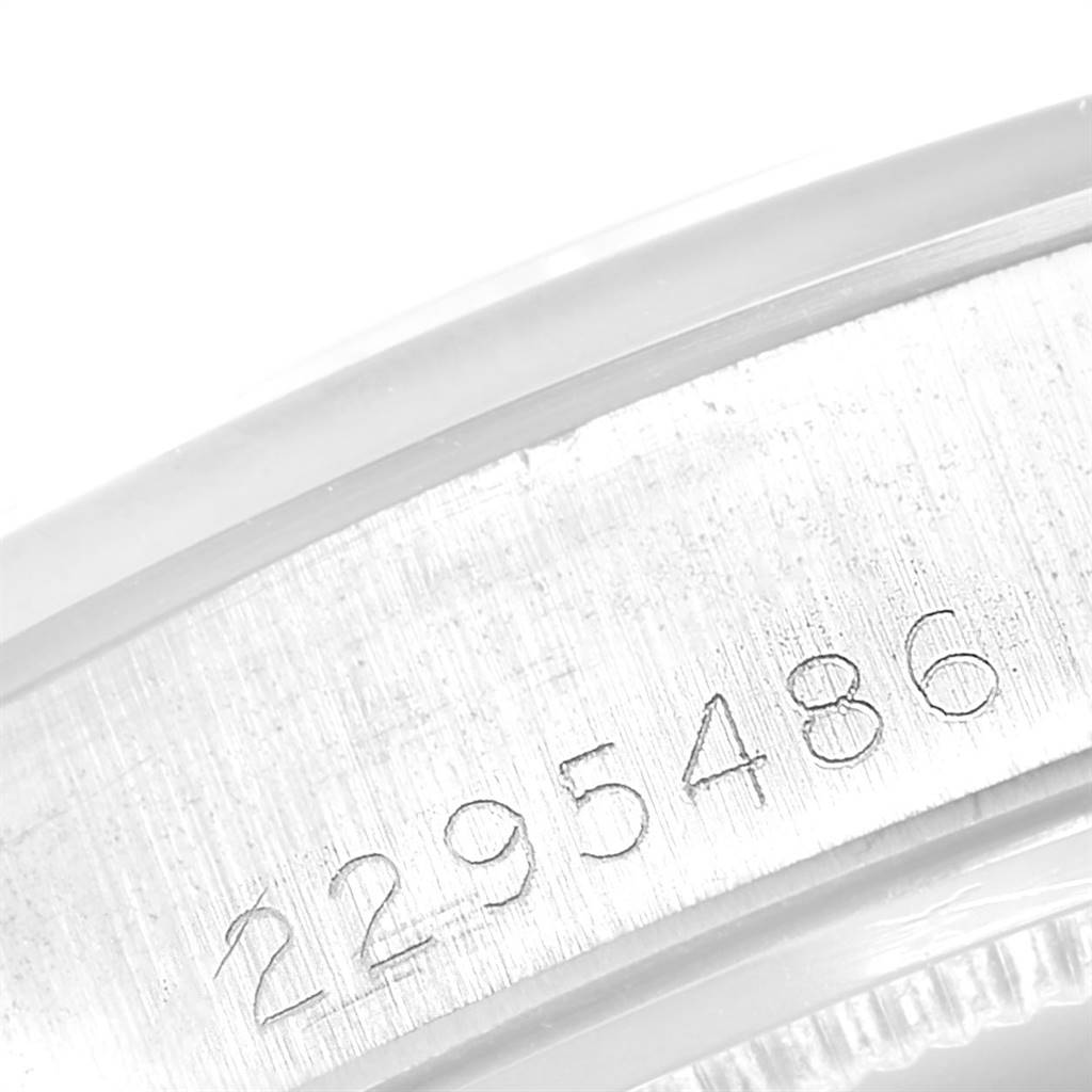 The image shows a close-up angle of the serial number engraved on the side of a Rolex Vintage Collection 6694 Men
s Stainless Steel Silver Dial 6694 Men
s Stainless Steel Silver Dial model watch.
