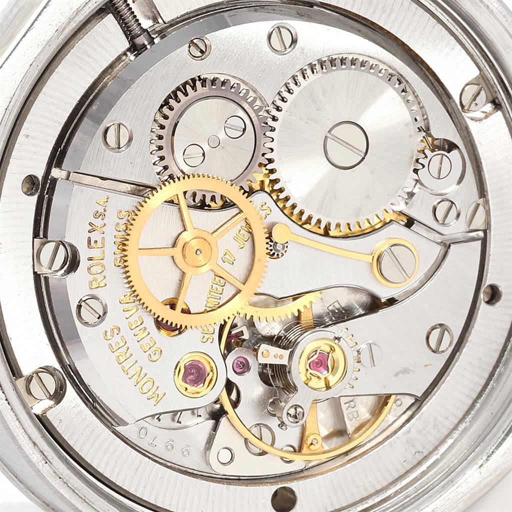 The image shows the inner mechanical movement of a Vintage Collection Rolex watch, viewed from the back.