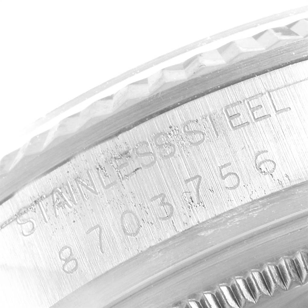 This image shows a close-up of the engraved side of the case for a Vintage Collection model by Rolex.