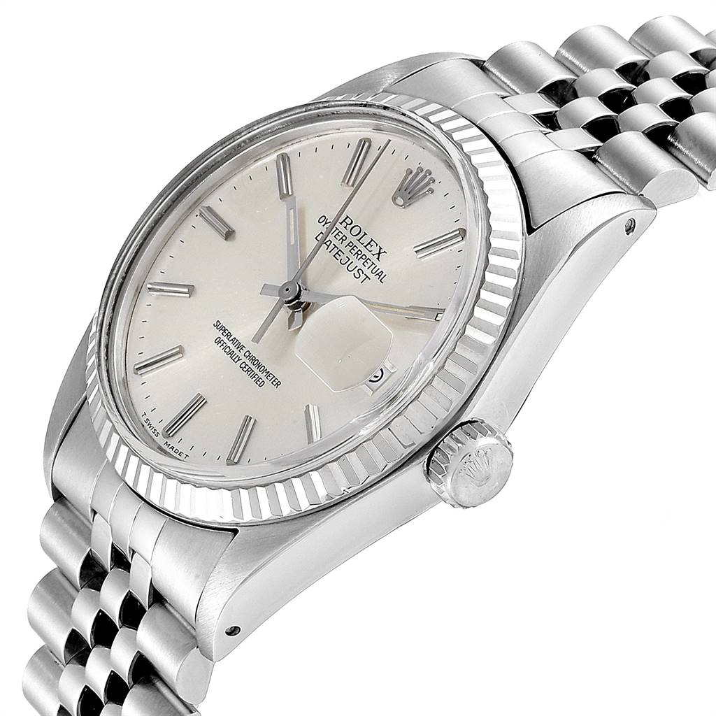 The image shows a side angle of a Rolex Vintage Collection 16014 Men
s Stainless Steel Silver Dial 16014 Men
s Stainless Steel Silver Dial watch, displaying its dial, crown, bezel, and part of the bracelet.