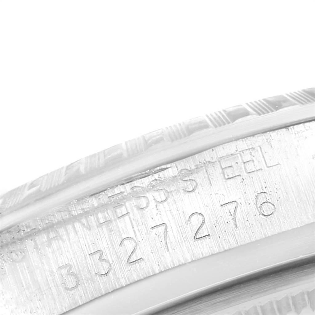 This close-up image shows the engraved serial number and "STAINLESS STEEL" marking on the case back rim of the Rolex Vintage Collection 1603 Men
s Stainless Steel Silver Dial 1603 Men
s Stainless Steel Silver Dial model.