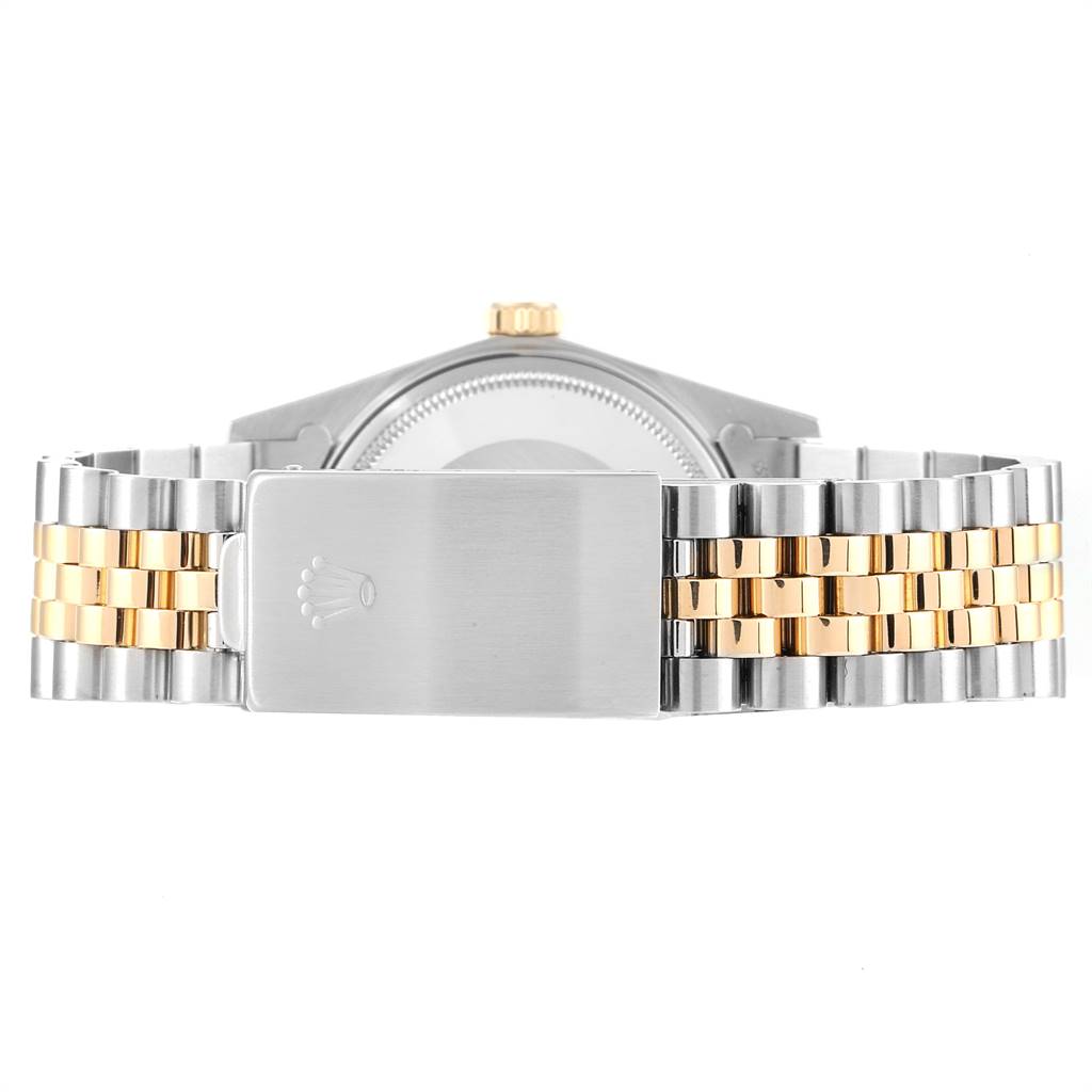 This image shows the back of a Rolex Vintage Collection 16013 Men's Stainless Steel Brown Dial 16013 Men's Stainless Steel Brown Dial watch, highlighting its two-tone metal bracelet and clasp.