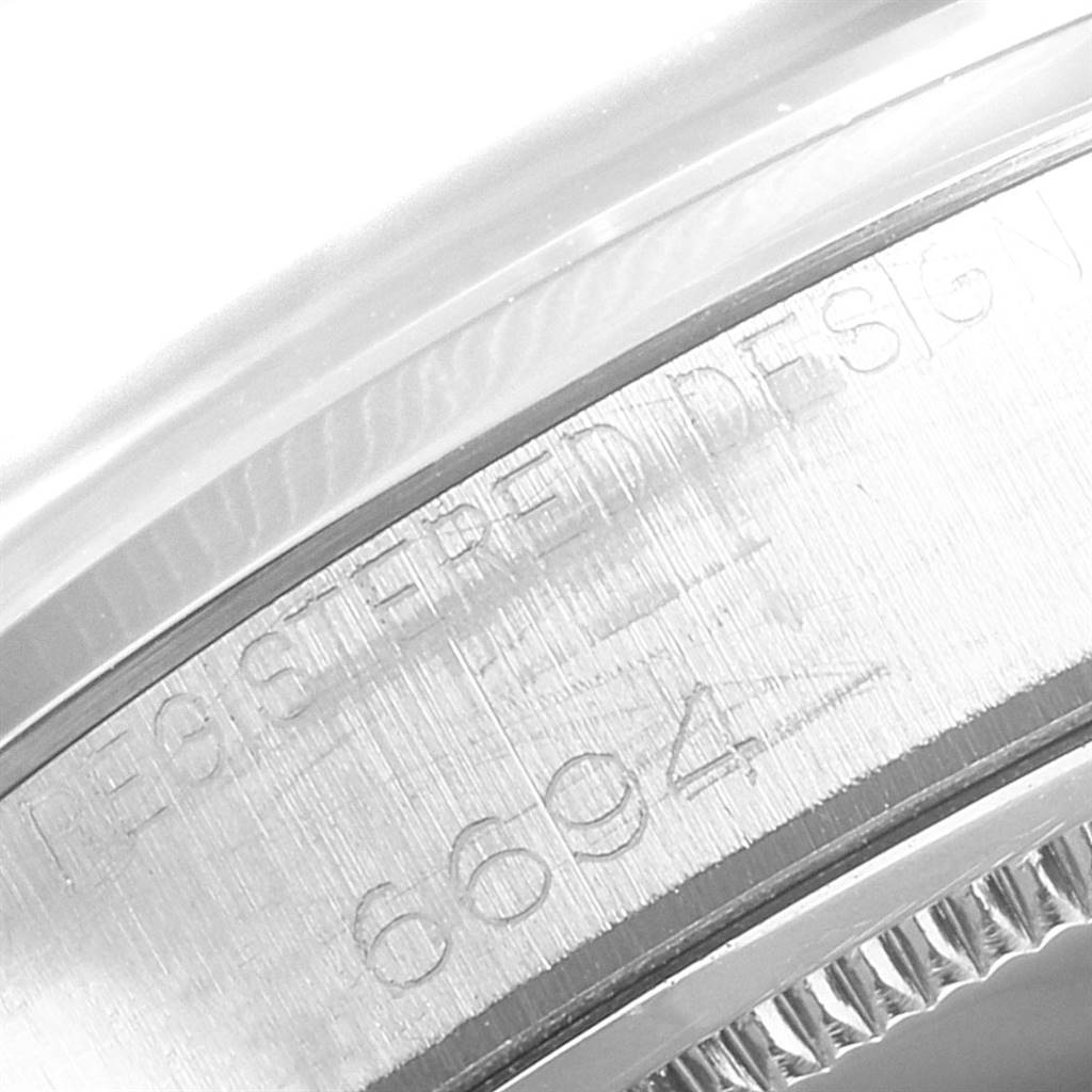 This close-up image showcases the case side and model number engraving of a Vintage Collection watch by Rolex.