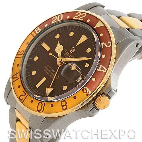 The image shows a side angle of the Rolex Vintage Collection 1675 Men's Stainless Steel Brown Dial 1675 Men's Stainless Steel Brown Dial watch, highlighting the bezel, crown, and part of the two-tone strap.
