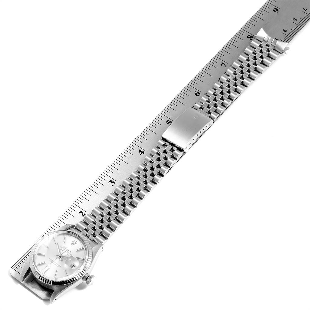 This image shows the Rolex Vintage Collection 16014 Men
s Stainless Steel Silver Dial 16014 Men
s Stainless Steel Silver Dial watch laid flat, emphasizing the face and the full length of the metal bracelet.