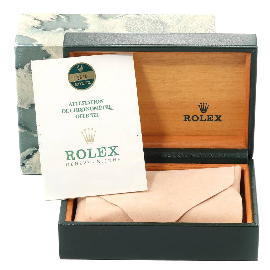 The image shows the open box and official papers for a Rolex Vintage Collection 16014 Men
s Stainless Steel Silver Dial 16014 Men
s Stainless Steel Silver Dial model.
