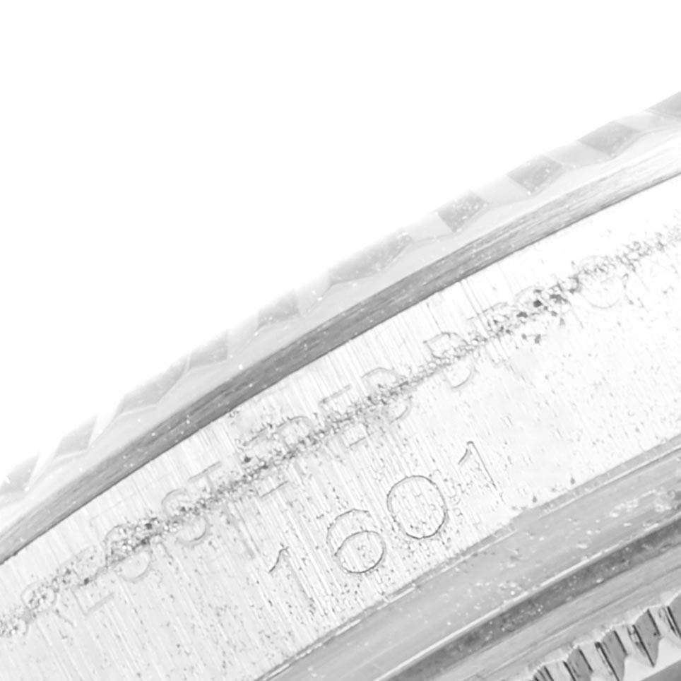 The image shows a close-up view of the engraved case side of a Vintage Collection Rolex watch, model 1601.