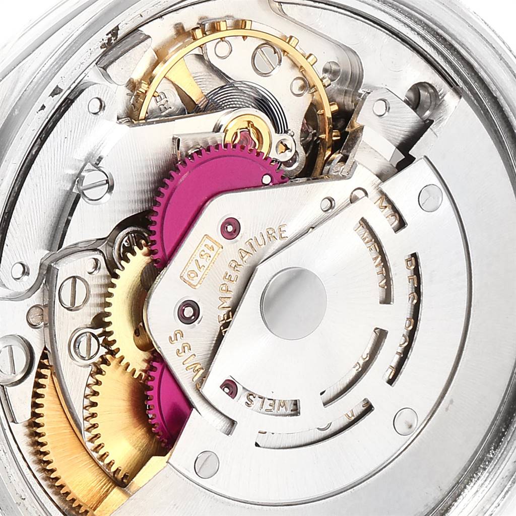 The image shows the intricate internal mechanism of the Rolex Vintage Collection 1601 Men
s Stainless Steel Silver Dial 1601 Men
s Stainless Steel Silver Dial watch, highlighting gears and movements.