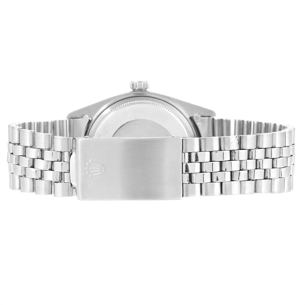 The image shows the back view of a Rolex Vintage Collection 1601 Men
s Stainless Steel Silver Dial 1601 Men
s Stainless Steel Silver Dial watch featuring its stainless steel bracelet and clasp.