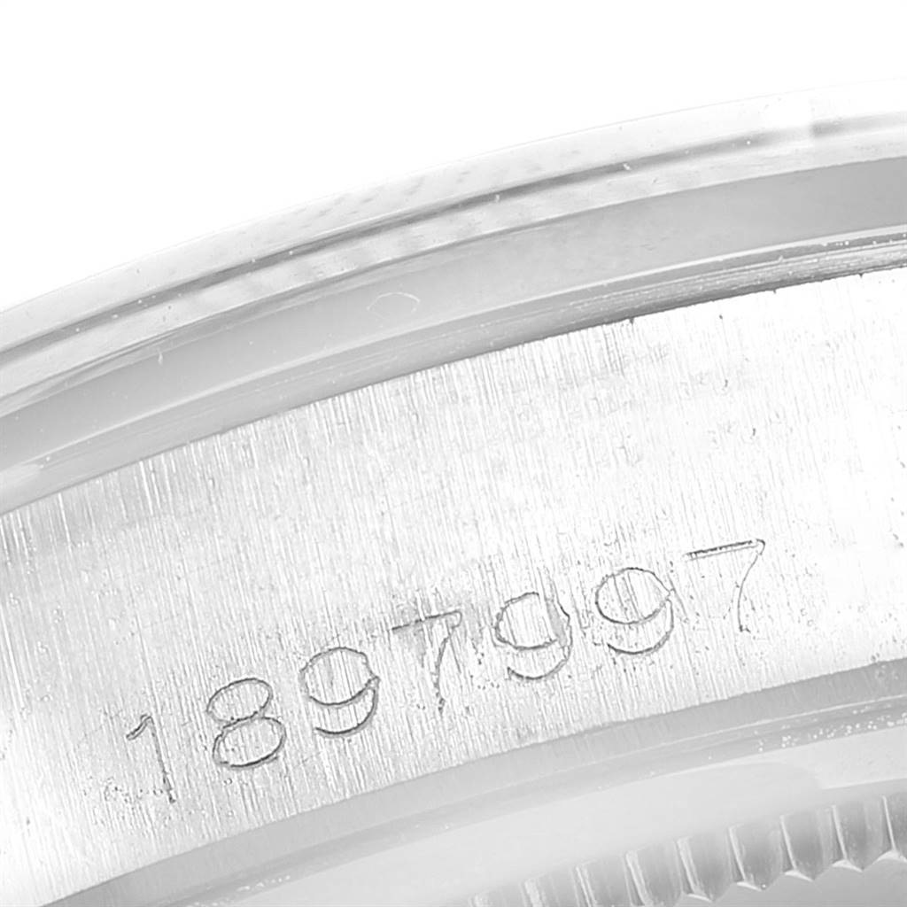 The image shows a close-up of the serial number engraving on the case of the Rolex Vintage Collection 6694 Men
s Stainless Steel Silver Dial 6694 Men
s Stainless Steel Silver Dial watch.