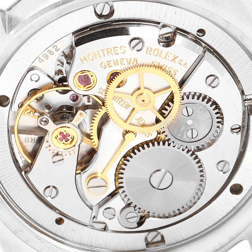This image shows the internal mechanical movement of a Vintage Collection Rolex watch, focusing on the intricate gears and components.