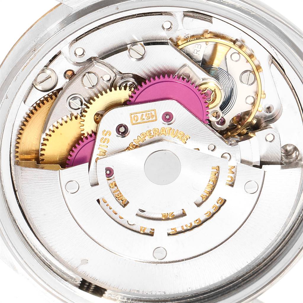 This image shows the intricate movement and internal gears of the Rolex Vintage Collection 1601 Men's Steel and Gold (two tone) Grey Dial 1601 Men's Steel and Gold (two tone) Grey Dial watch from a close-up angle.