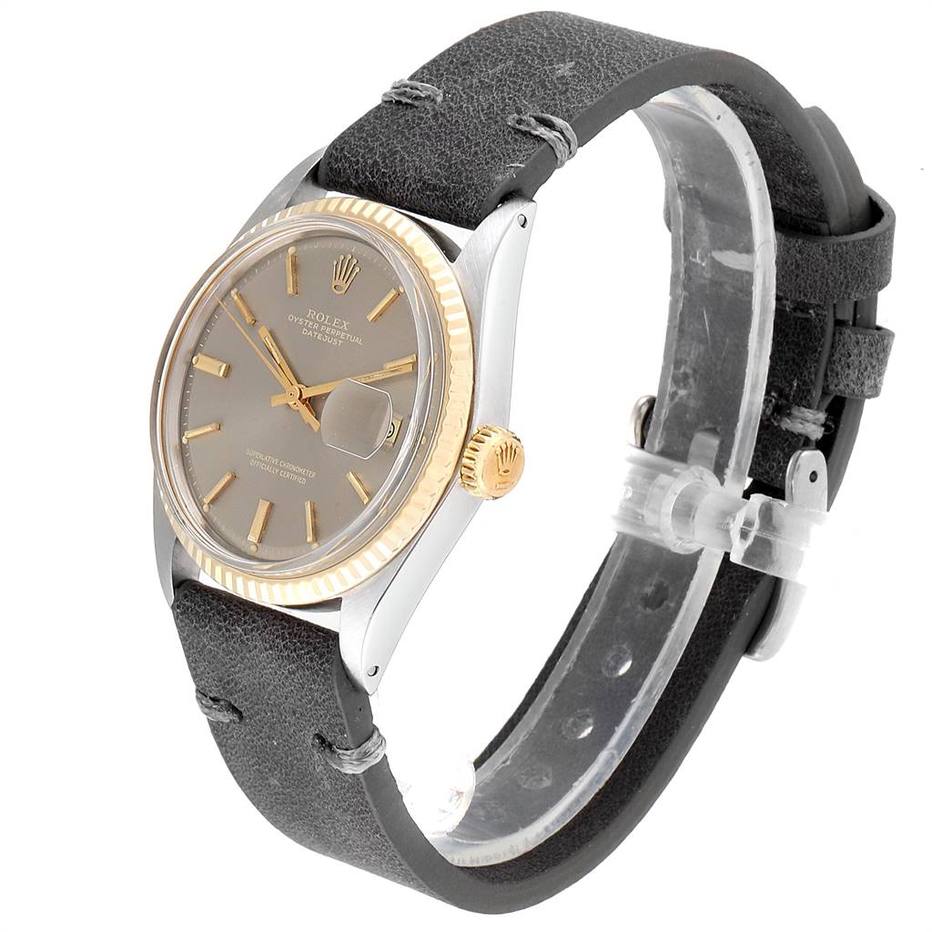 This image shows a Rolex Vintage Collection 1601 Men's Steel and Gold (two tone) Grey Dial 1601 Men's Steel and Gold (two tone) Grey Dial watch at a three-quarter angle, featuring the dial, bezel, crown, and leather strap.