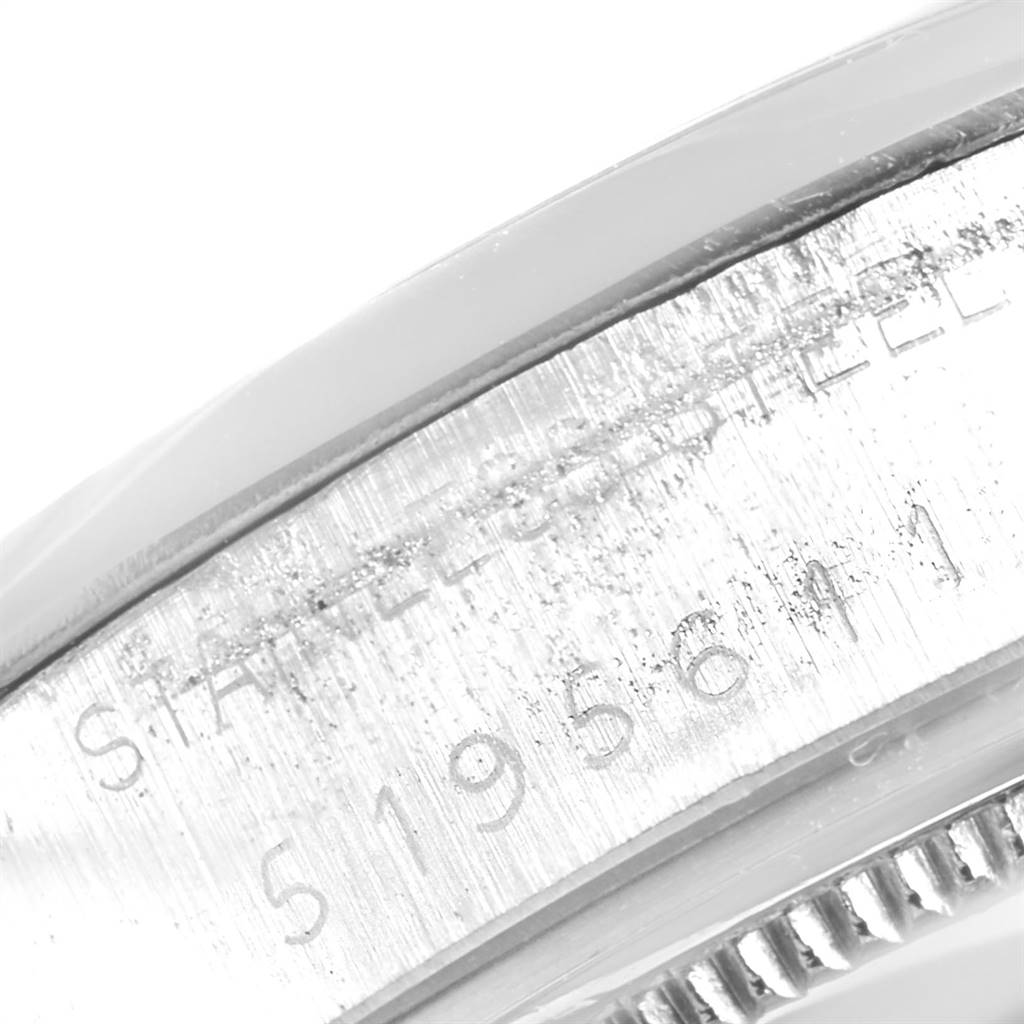 The image shows a close-up of the side engravings on the Rolex Vintage Collection 6694 Men's Stainless Steel Black Dial 6694 Men's Stainless Steel Black Dial watch case.