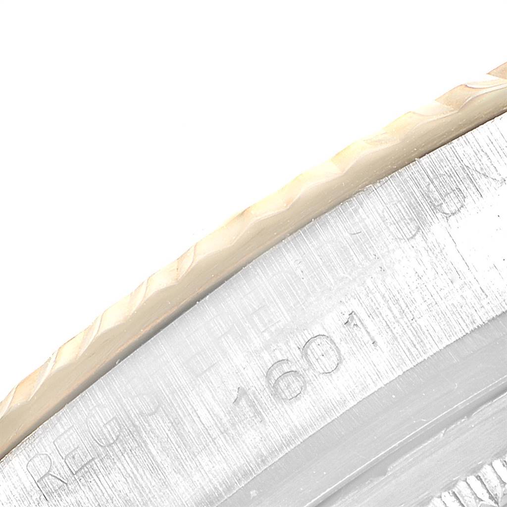 This close-up image of the Rolex Vintage Collection 1601 Men
s Steel and Gold (two tone) Blue Dial 1601 Men
s Steel and Gold (two tone) Blue Dial model shows the engraved reference number 1601 on the watch case edge.