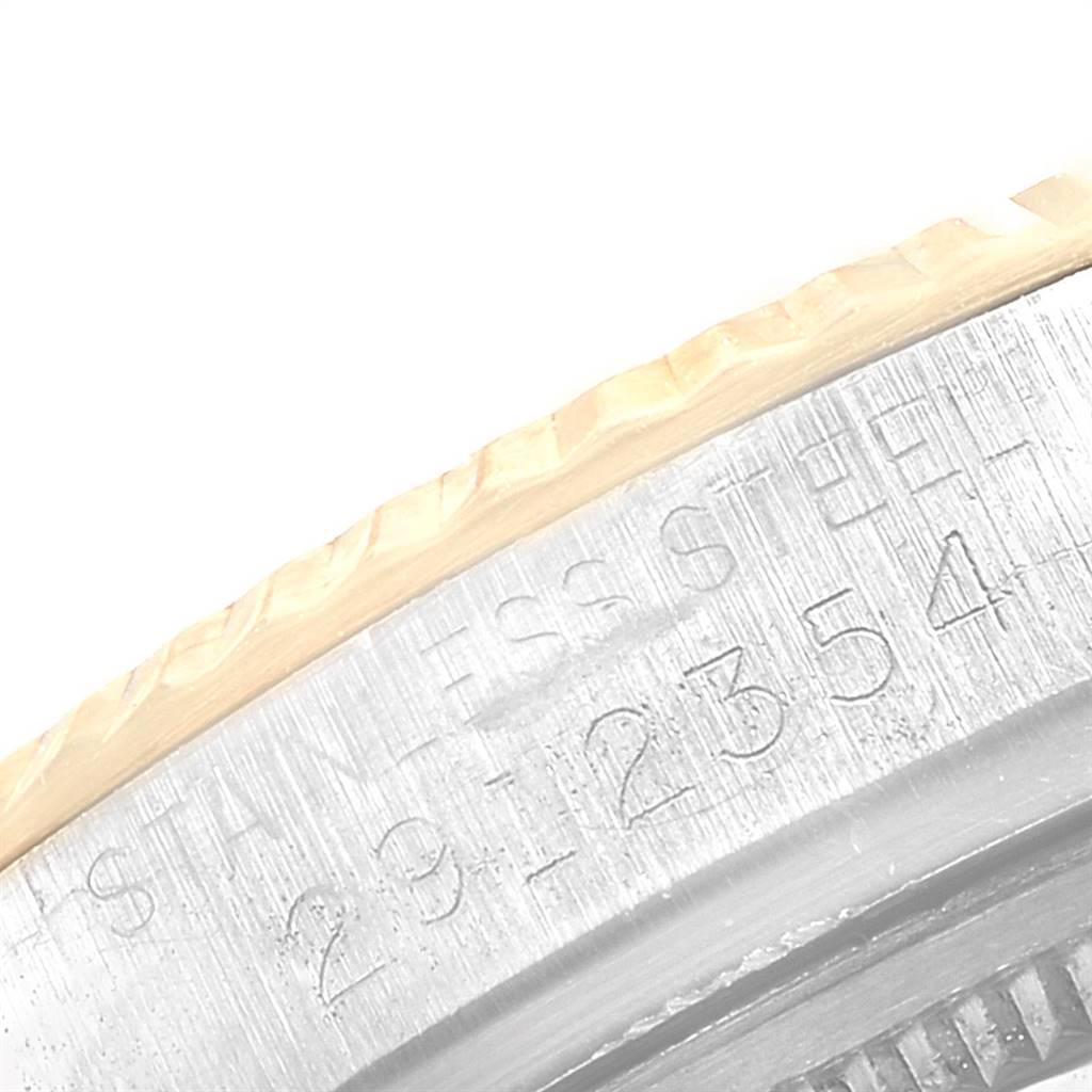 This close-up image shows the side of the case and bezel with engraved details on the Rolex Vintage Collection 1601 Men
s Steel and Gold (two tone) Blue Dial 1601 Men
s Steel and Gold (two tone) Blue Dial watch.