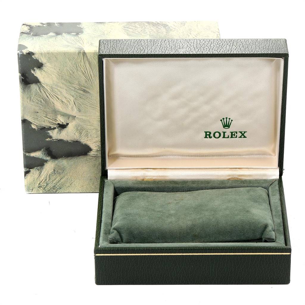 The image shows an open Rolex Vintage Collection 1601 Men
s Steel and Gold (two tone) Blue Dial 1601 Men
s Steel and Gold (two tone) Blue Dial watch box, displaying the cushion inside and the Rolex logo on the lid.