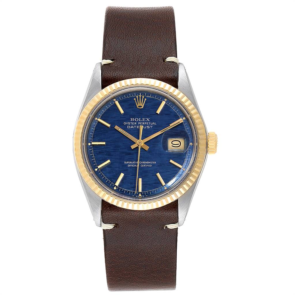 The image shows a front view of the Rolex Vintage Collection 1601 Men
s Steel and Gold (two tone) Blue Dial 1601 Men
s Steel and Gold (two tone) Blue Dial model with a blue dial, gold bezel, and a brown leather strap.