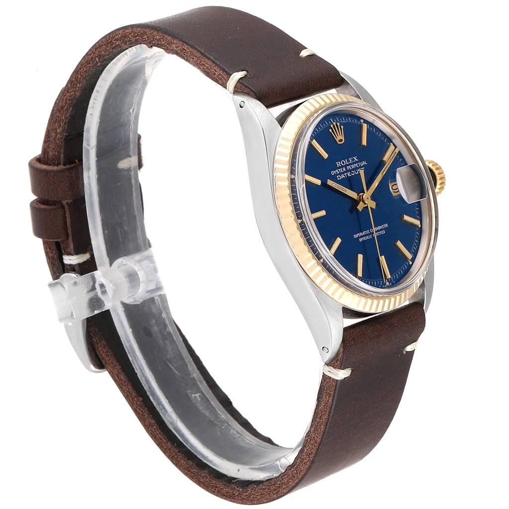 The Rolex Vintage Collection 1601 Men
s Steel and Gold (two tone) Blue Dial 1601 Men
s Steel and Gold (two tone) Blue Dial model is shown at a side angle, displaying its blue dial, gold bezel, and brown leather strap.