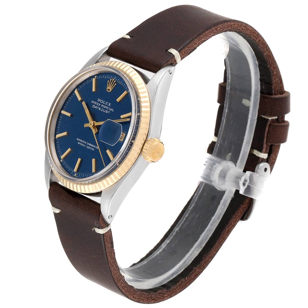 The watch is the Rolex Vintage Collection 1601 Men
s Steel and Gold (two tone) Blue Dial 1601 Men
s Steel and Gold (two tone) Blue Dial model, shown at a slight side angle, displaying the dial, crown, case, and leather strap.