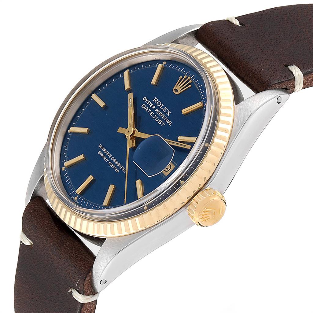 The image shows a Rolex Vintage Collection 1601 Men
s Steel and Gold (two tone) Blue Dial 1601 Men
s Steel and Gold (two tone) Blue Dial Datejust watch from an angled side view, highlighting the dial, bezel, and crown.