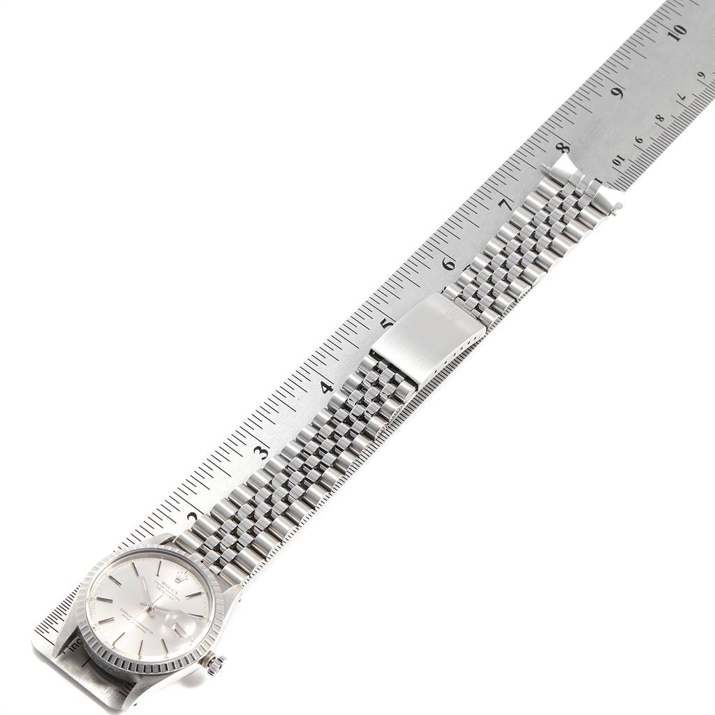 The Rolex Vintage Collection 16030 Men's Stainless Steel Silver Dial 16030 Men's Stainless Steel Silver Dial watch is shown flat with its entire metal band and face visible alongside a ruler for scale.